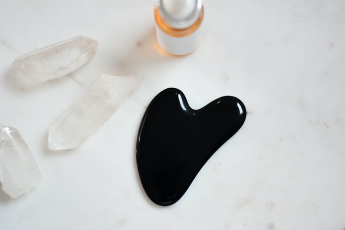 Flatlay Image of Beauty Products for a Gua Sha Facial